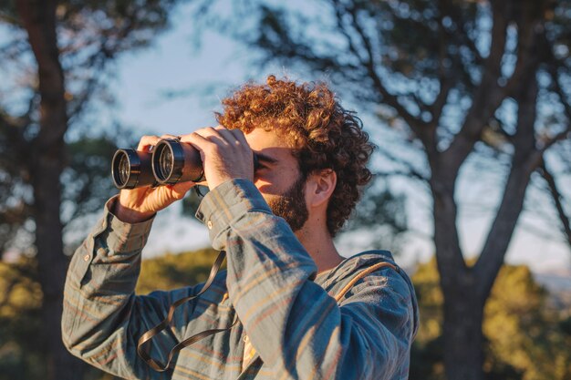 man with binoculars nature_23 2147770875