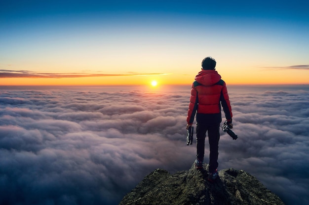 photographer hand holding camera standing viewpoint clouds panorama viewpoint sunrise_335224 1320